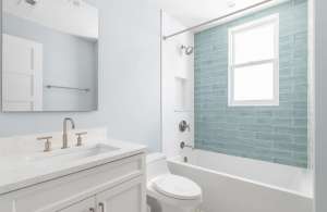 A,Bathroom,With,A,White,Vanity,Cabinet,,White,Marble,Countertop,